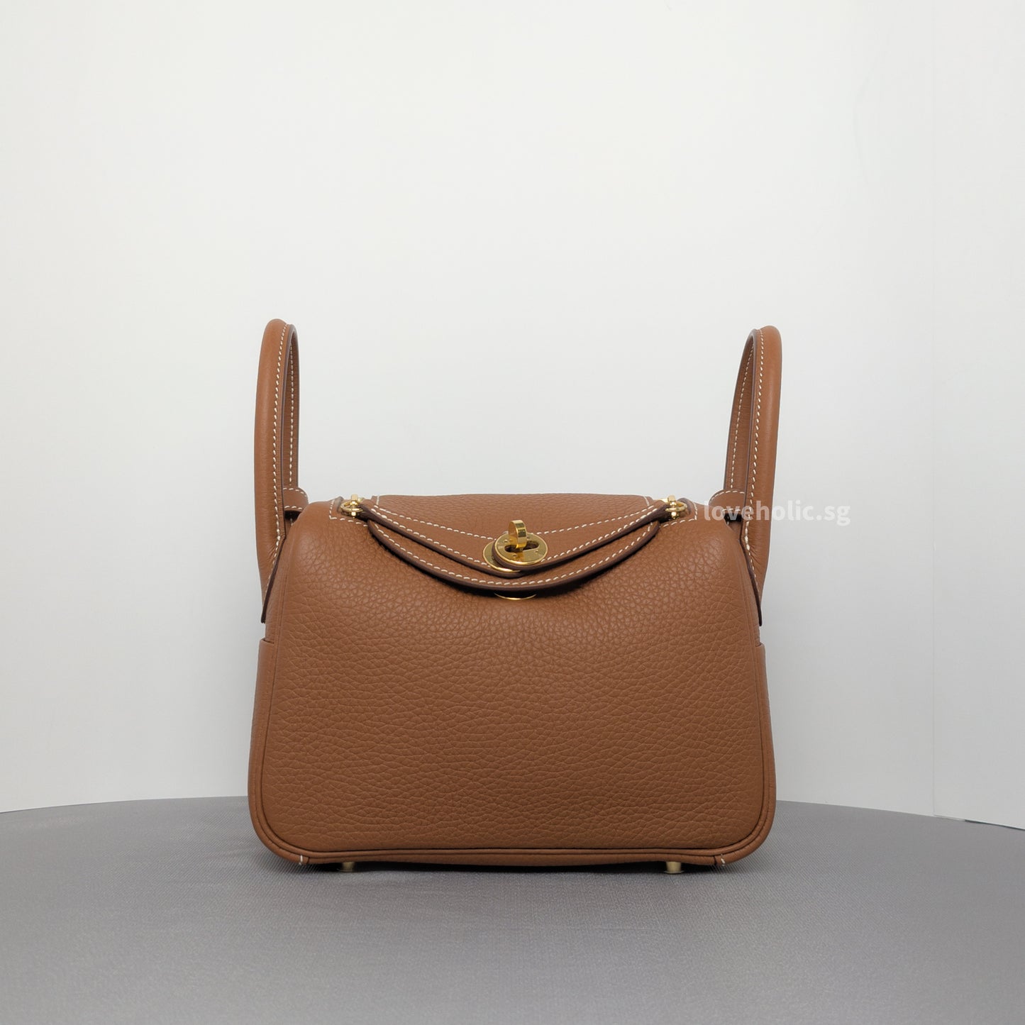 Hermes Lindy Gold Taurillon Clemence Gold Hardware-whitebackground