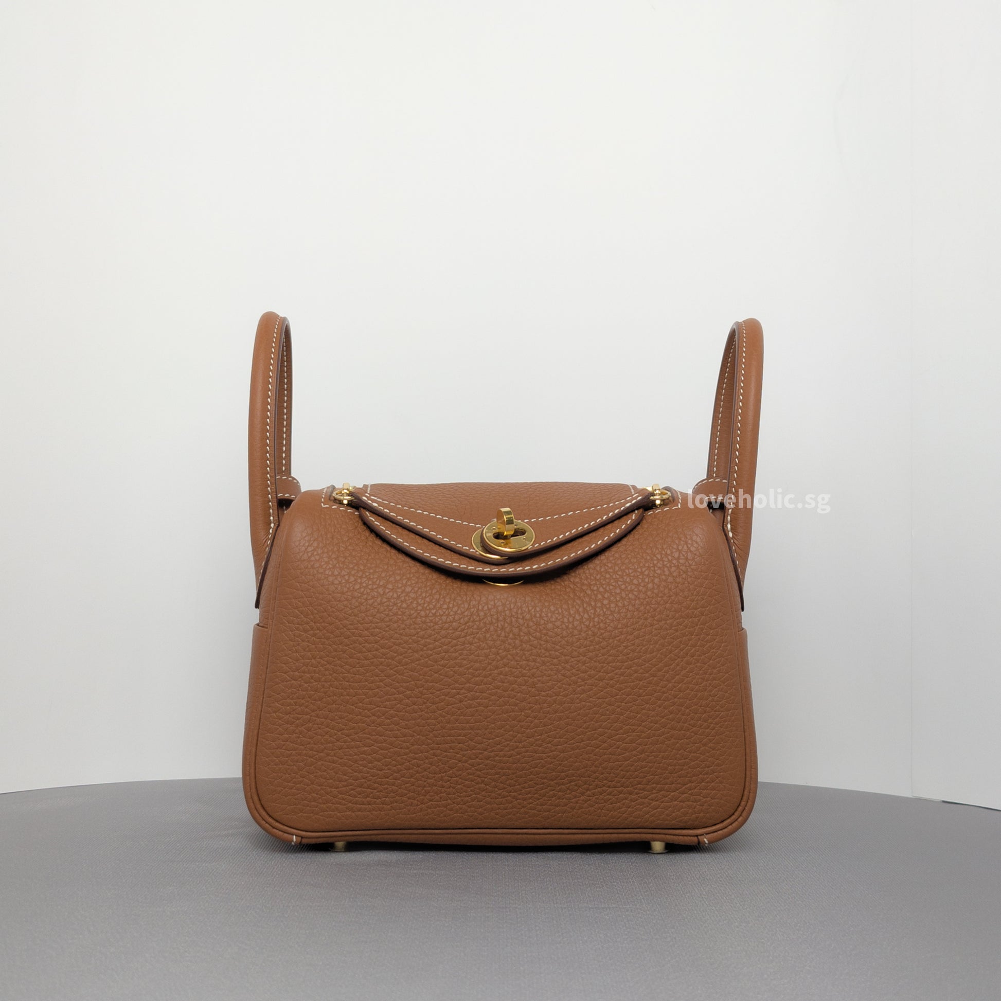 Hermes Lindy Gold Taurillon Clemence Gold Hardware-whitebackground
