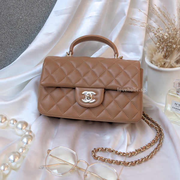 Chanel small flap bag online with top handle beige