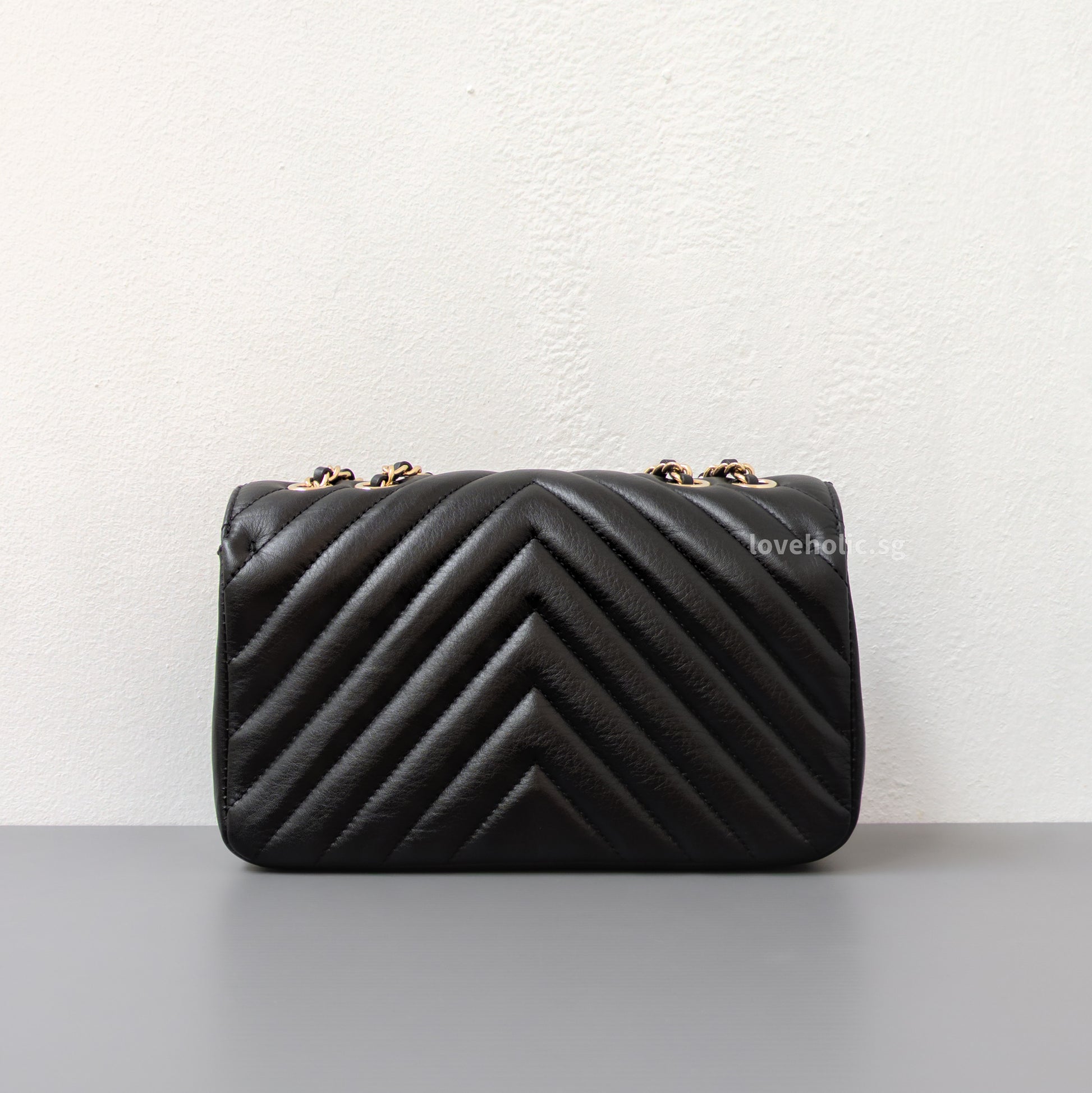 Chanel Statement Flap Bag Chevron Mini | Black Lambskin Light Gold Hardware-back
