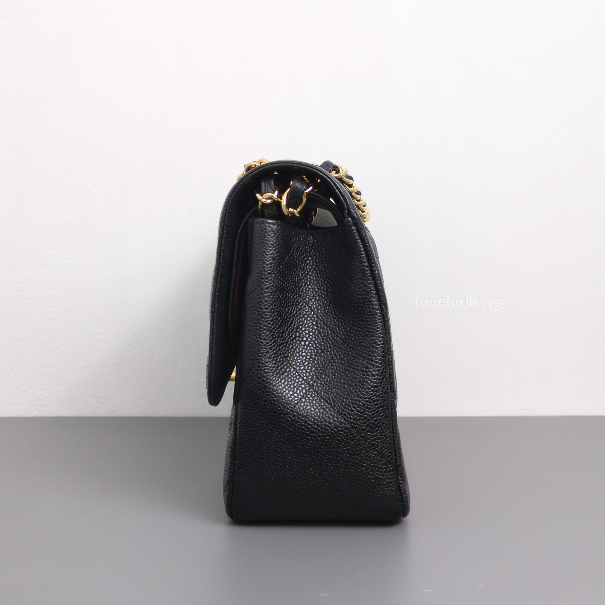 Chanel Classic Flap Jumbo | Black Caviar Gold Hardware-side
