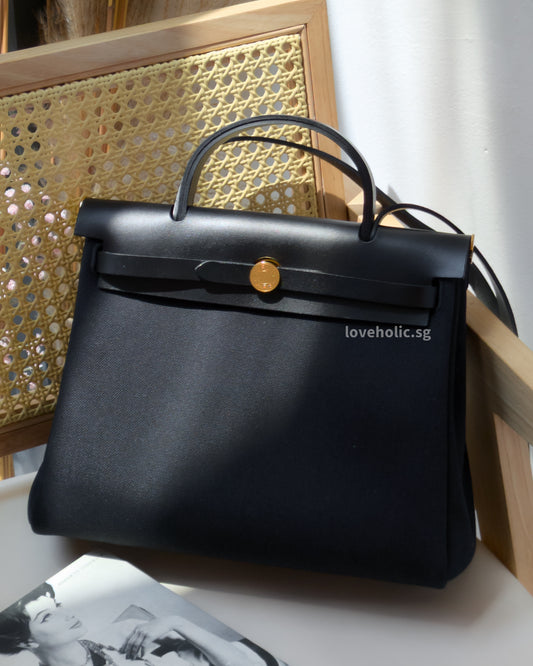 Hermes Herbag Zip 31 | Retourne Noir Canvas Gold Hardware-front