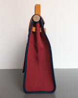 Hermes Herbag 31 Tilt Toile Officier/ Vache Hunter | Ruby/ Malta Blue Palladium Hardware-side