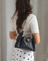  Chanel 25 Mini | Black Caviar Brushed Gold Hardware-model