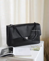 Chanel Maxi Flap 38cm  | 26A Black Caviar Silver Hardware-front